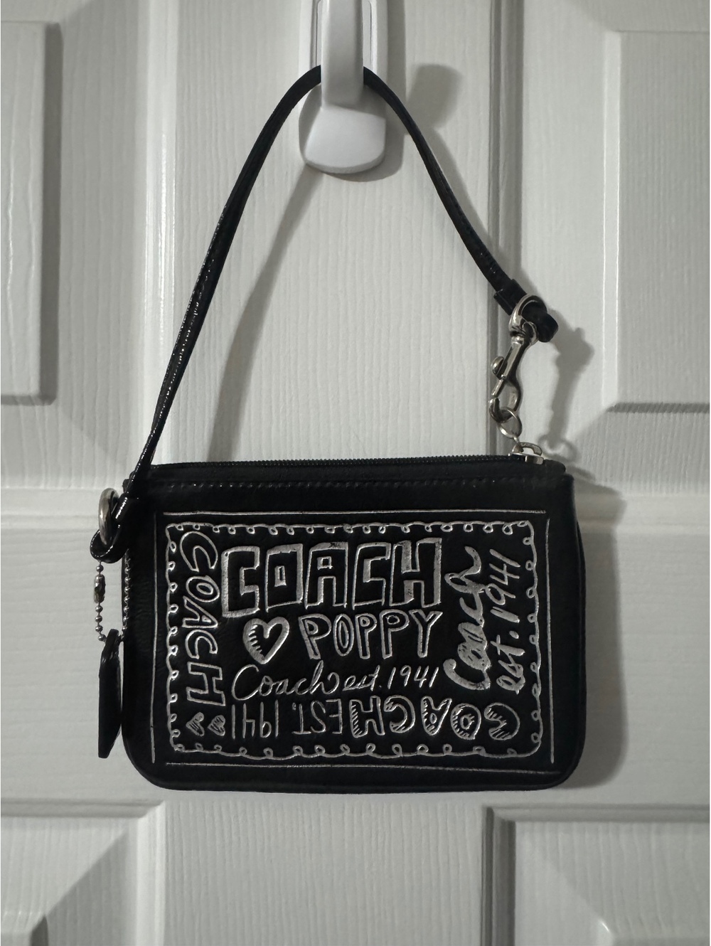 C41. Coach poppy black wristlet